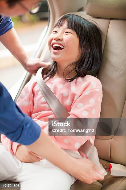 Father Take Care Daughter To Fasten A Seat Belt Stock Photo - Download Image Now - Adult, Asia, Assistance