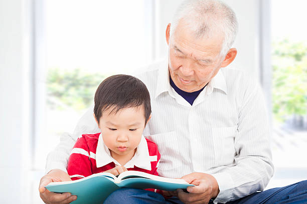 istock grandfather telling story to his grandson 491704831