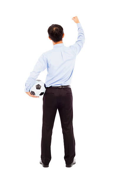 istock Back view of young businessman hold a ball 491705451