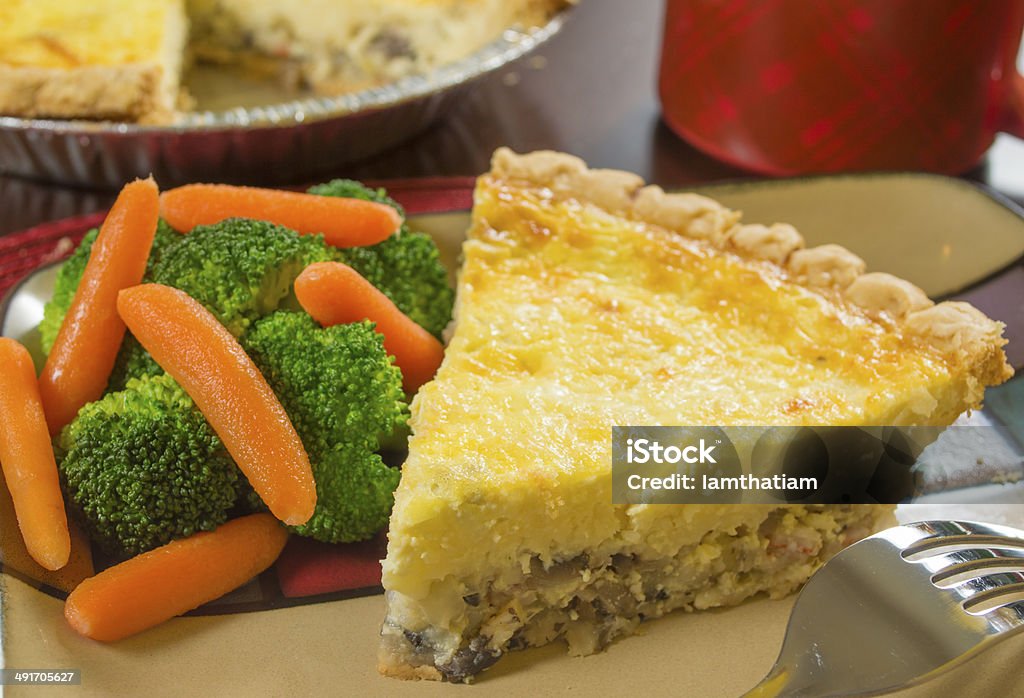 crab quiche with vegetables serving of crab quiche with vegetables Baked Stock Photo