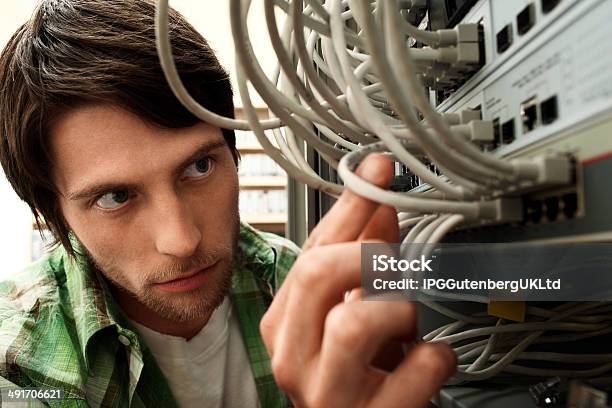Network Engineer Working In Server Room Stock Photo - Download Image Now - Adjusting, Adult, Business