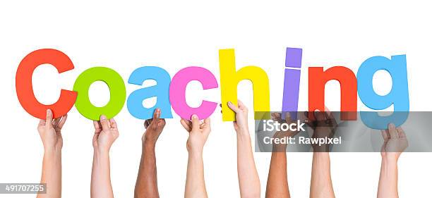 Diverse Hands Holding The Word Coaching Stock Photo - Download Image Now - Coach, Teaching, Single Word