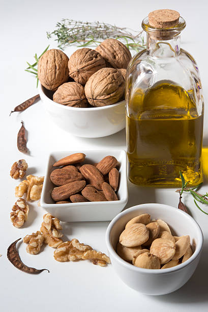 istock nuts and olive oil bottle 491707828