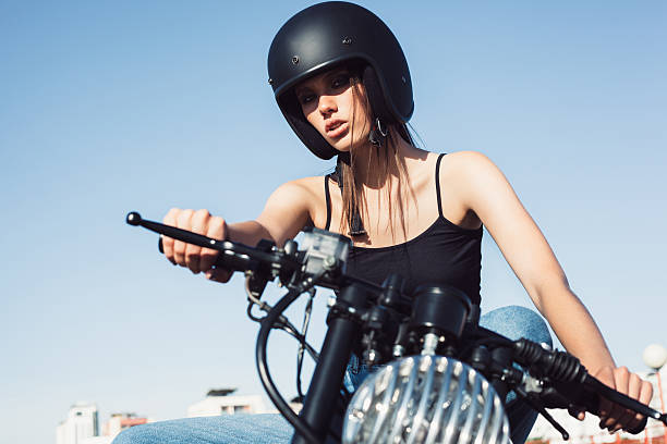 istock Biker girl sitting on vintage custom motorcycle 491707838