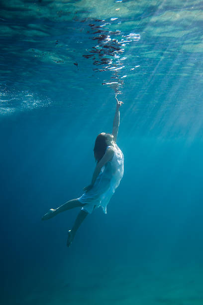 Underwater Young redhead woman underwater zero gravity stock pictures, royalty-free photos & images