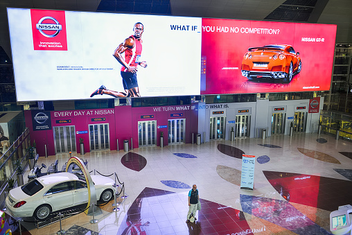 Dubai, United Arab Emirates - April 18, 2014: Dubai International Airport interior. Dubai International Airport is a major international airport located in Dubai, and is the world's busiest airport by international passenger traffic.