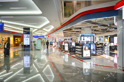 Dubai, United Arab Emirates - April 18, 2014: Dubai International Airport interior. Dubai International Airport is a major international airport located in Dubai, and is the world's busiest airport by international passenger traffic.