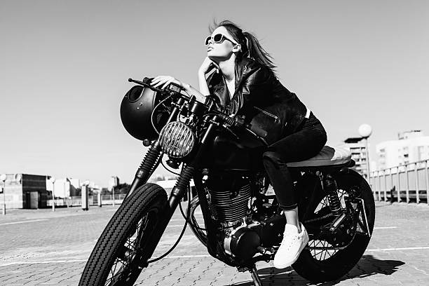istock Biker girl sitting on vintage custom motorcycle 491711436