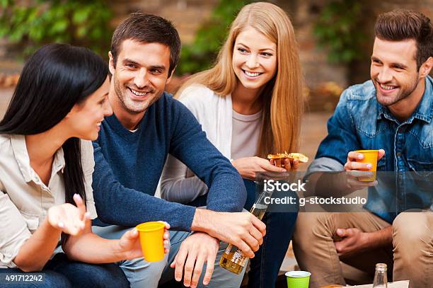 Sharing The Latest News Stock Photo - Download Image Now - 2015, Adult, Alcohol - Drink