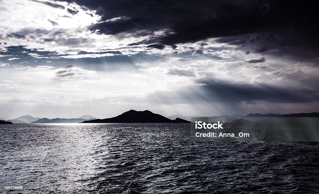 Night seascape Beautiful night seascape, abstract natural background, dramatic cloudscape, island in moonlight, mysterious water landscape, magic night 2015 Stock Photo