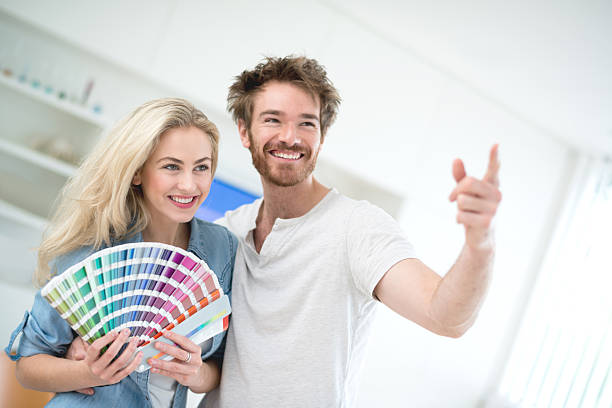 istock Couple painting their house 491714234