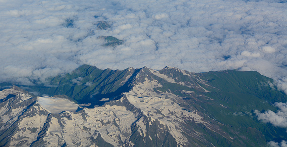 Aerial view of Himalaya mountains with clouds in the morning light, Ladakh, India.