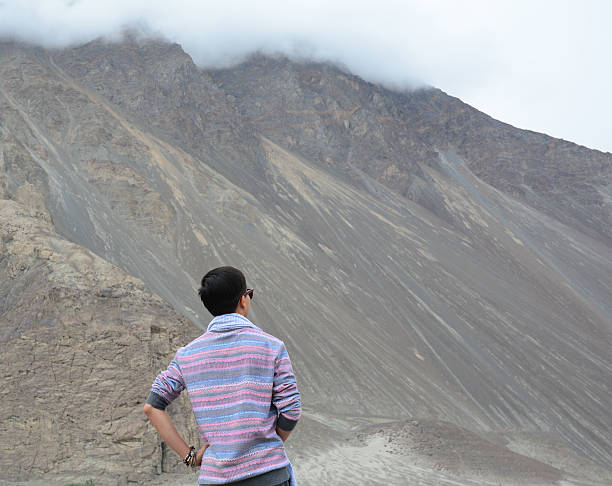 istock Asian traveler enjoying mountain view 491724928