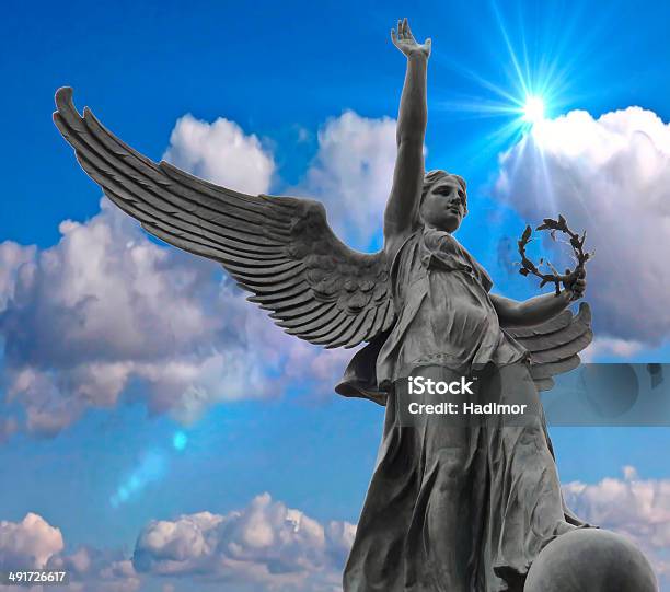 Statue In The Blue Sky Stock Photo - Download Image Now - Angel, Flying, Animal Body Part