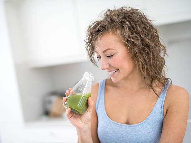 istock Woman detoxing drinking a healthy juice 491729208