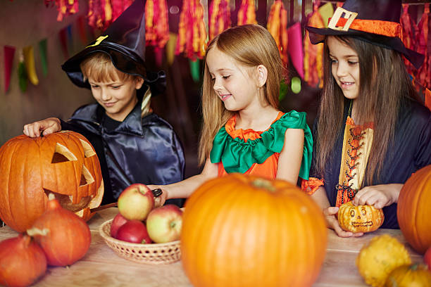 istock Cooperation during the work on carving a pumpkin 491731050