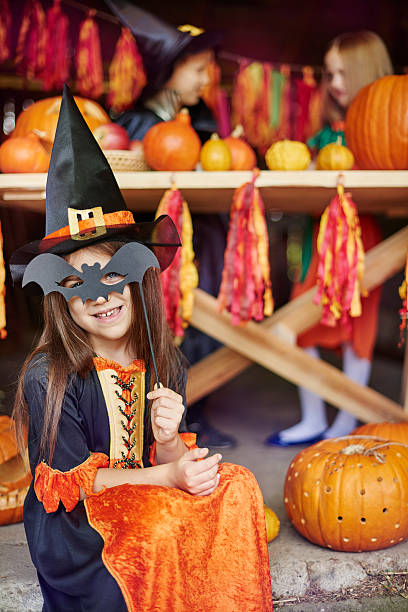 istock Girl posing with a bat mask 491731848