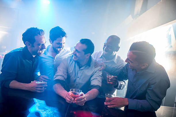 Men night out Men night out having fun at a club drinking and looking very happy stag night stock pictures, royalty-free photos & images