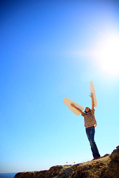 istock boy with wings and the sun 491747318