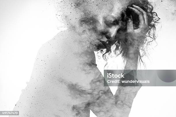 Unhappy Womans Form Double Exposed With Paint Splatter Effect Stock Photo - Download Image Now