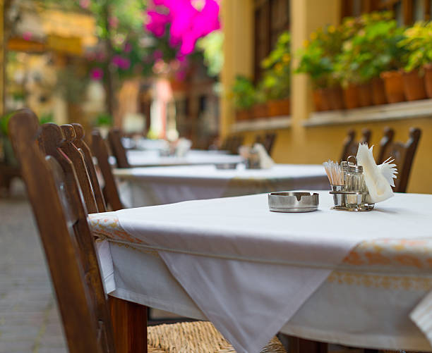istock Mediterranean restaurant terrace exterior with chairs. 491747580