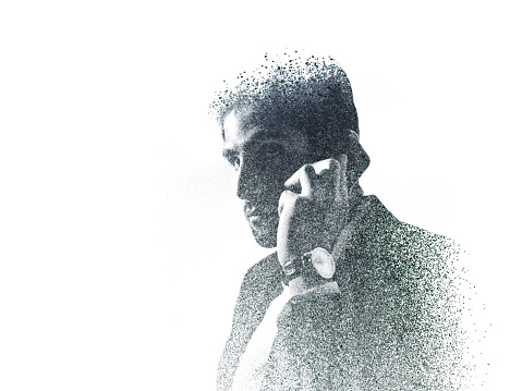 Graphic image of businessman on the phone created with dots