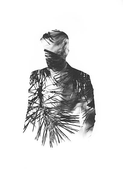 Subtle male form filled with pine needles in double exposure