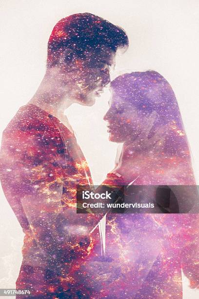 Silhouette Of A Loving Couple With Galaxy In Their Forms Stock Photo - Download Image Now