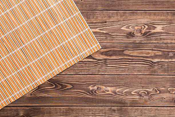 istock bamboo napkin on wooden table. top view 491761336