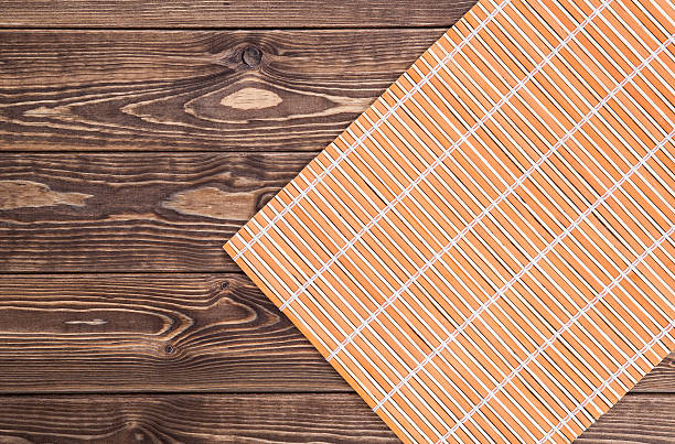 istock Japanese texture. bamboo napkin on wooden table. top view 491761394