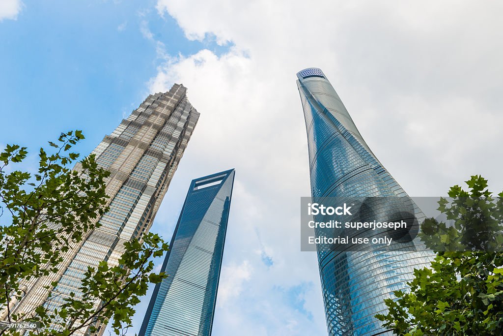 Landmark Tower in Shanghai Shanghai, Сhina - September 24, 2015: Shanghai Center, World Financial Center and Jin Mao Tower in Shanghai, China. These are the tallest buildings in Shanghai. 2015 Stock Photo
