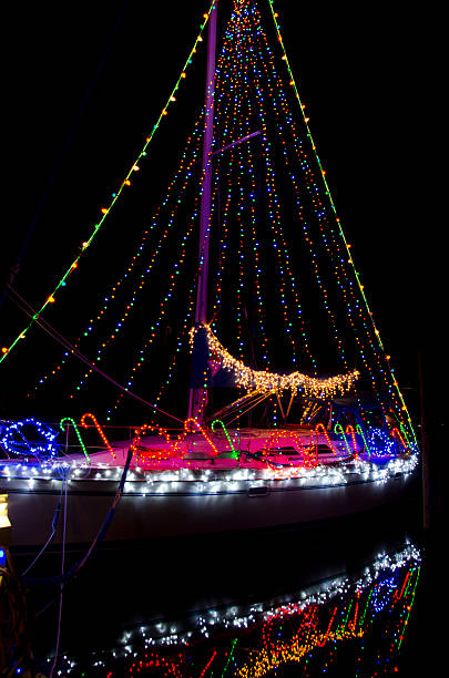 istock Christmas Sailboat in Nighttime Flotilla 491765118