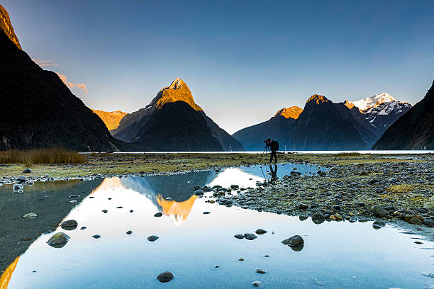 Milford sound in morning Photographer taking photo Milford sound view. fiordland national park photos stock pictures, royalty-free photos & images