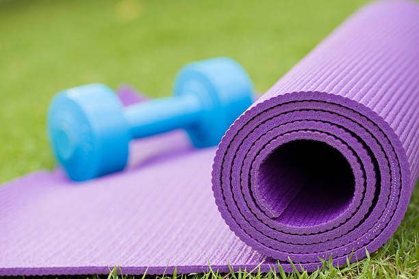 istock yoga mat and dumbbell 491766494