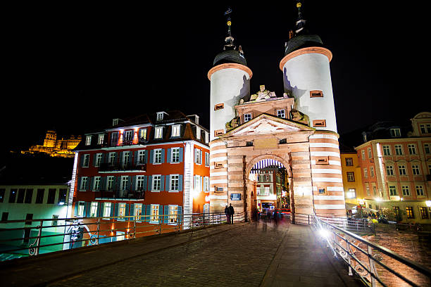 Gates and towers on Alte Brucke during night