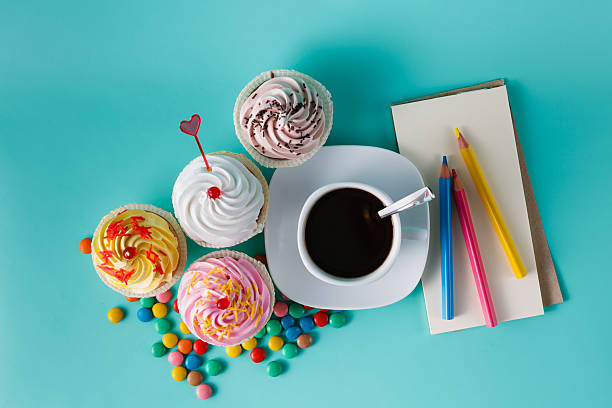Cupcakes with colorful confetti and coffee cup