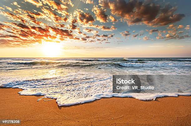 Brilliant Ocean Beach Sunrise Stock Photo - Download Image Now - 2015, Beach, Coastline