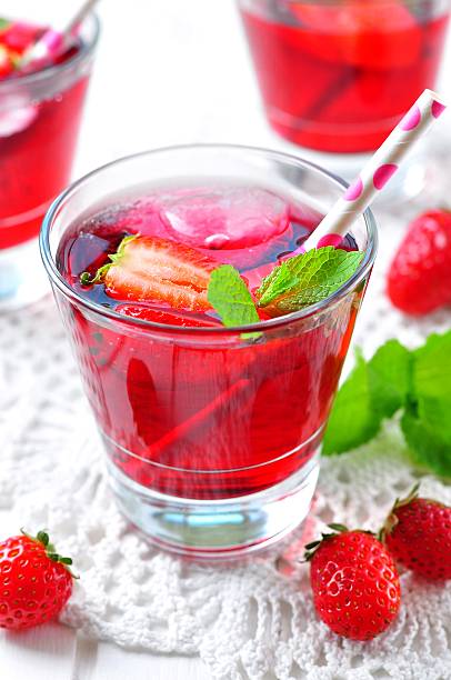 istock homemade strawberry compote with fresh berries, mint and ice cubes 491778700