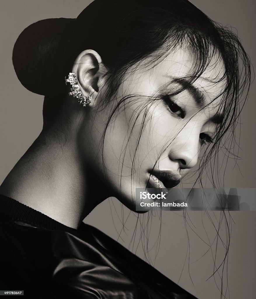 Asian beauty Portrait of asian beautiful woman with statement ear cuff. Professional make-up and hairstyle. High-end retouch. Fashion Model Stock Photo