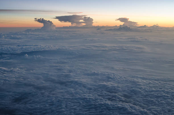 Bed of clouds from above at dawn stock photo