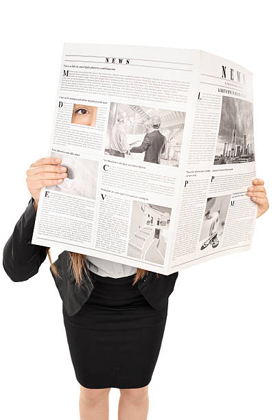 istock Woman hiding behind a newspaper 491785851