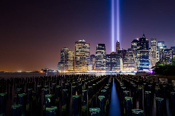 istock Lower Manhattan skyline night view from Brooklyn Bridge Park 491786464