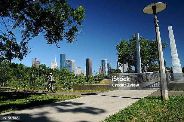 Cyclist Going Past Houston Texas Cityscape Stock Photo - Download Image Now - Cycling, Houston - Texas, Bicycle