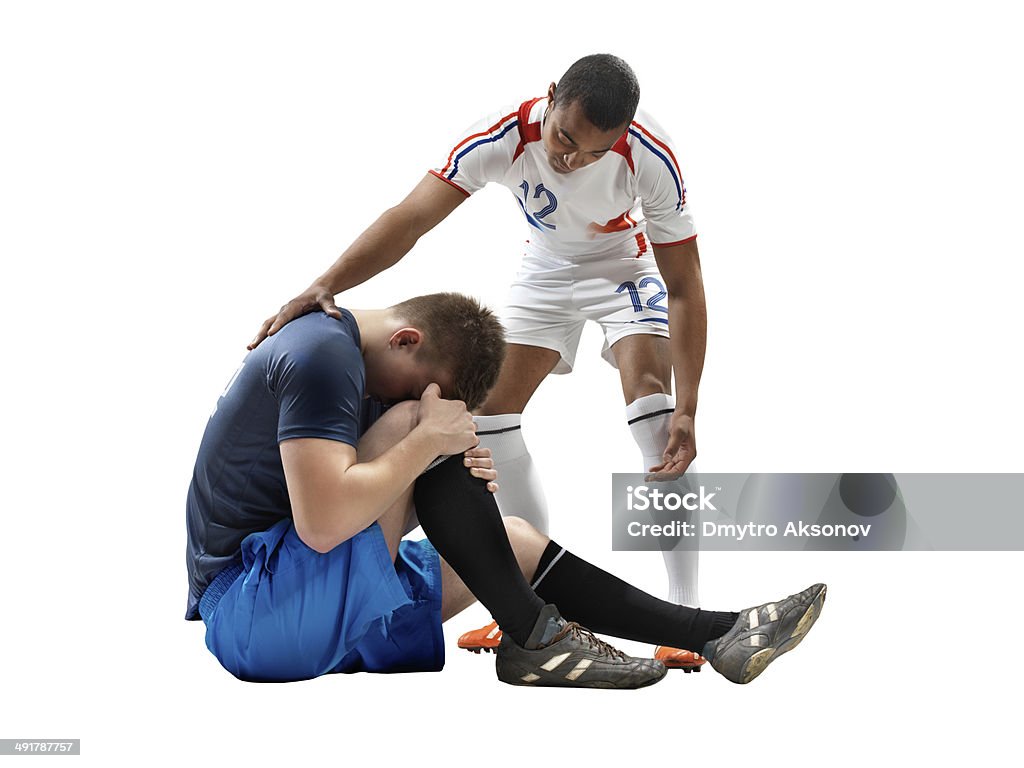 Giocatore di calcio di lesioni isolate - Foto stock royalty-free di Adolescente