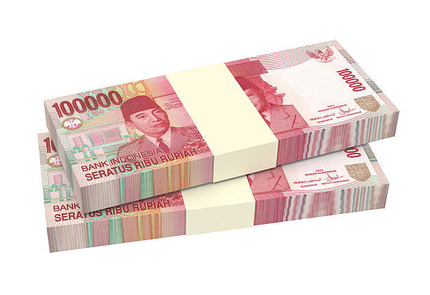 indonesische rupiah geld, isoliert auf weißem hintergrund. - indonesian currency stock-fotos und bilder