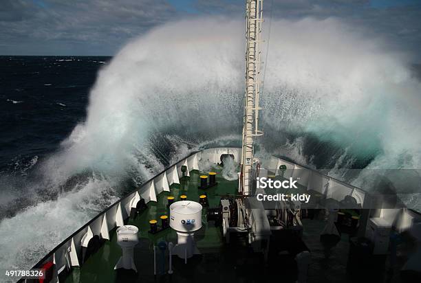 Big Wave Rolling Over Snout Of The Ship Stock Photo - Download Image Now - Ship, Storm, Sea