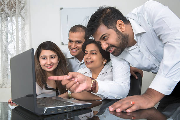 istock Young and cheerful Business team in a brainstorming session. 491788514