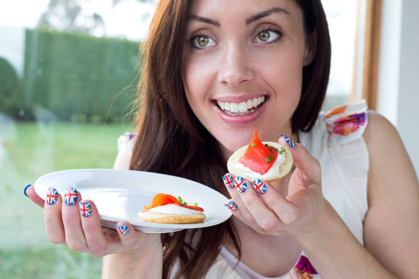 istock Woman Eating Canapes 491789301
