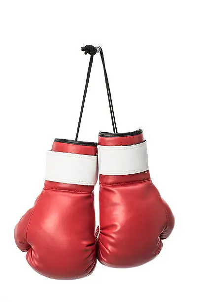 Red boxing gloves on white background