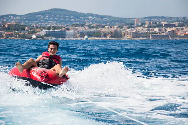 Photo of Man rides an inflatable tube